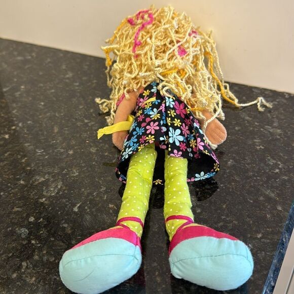 Denell -A blonde with a black floral dress.- Manhattan Toys. Size 13” - Picture 6 of 8